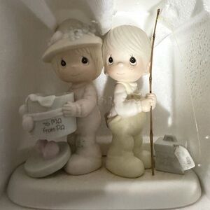 Precious Moments Figurine with Cream and White Accents
